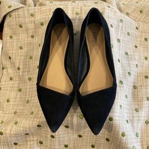 Black suede pointed toe flats.